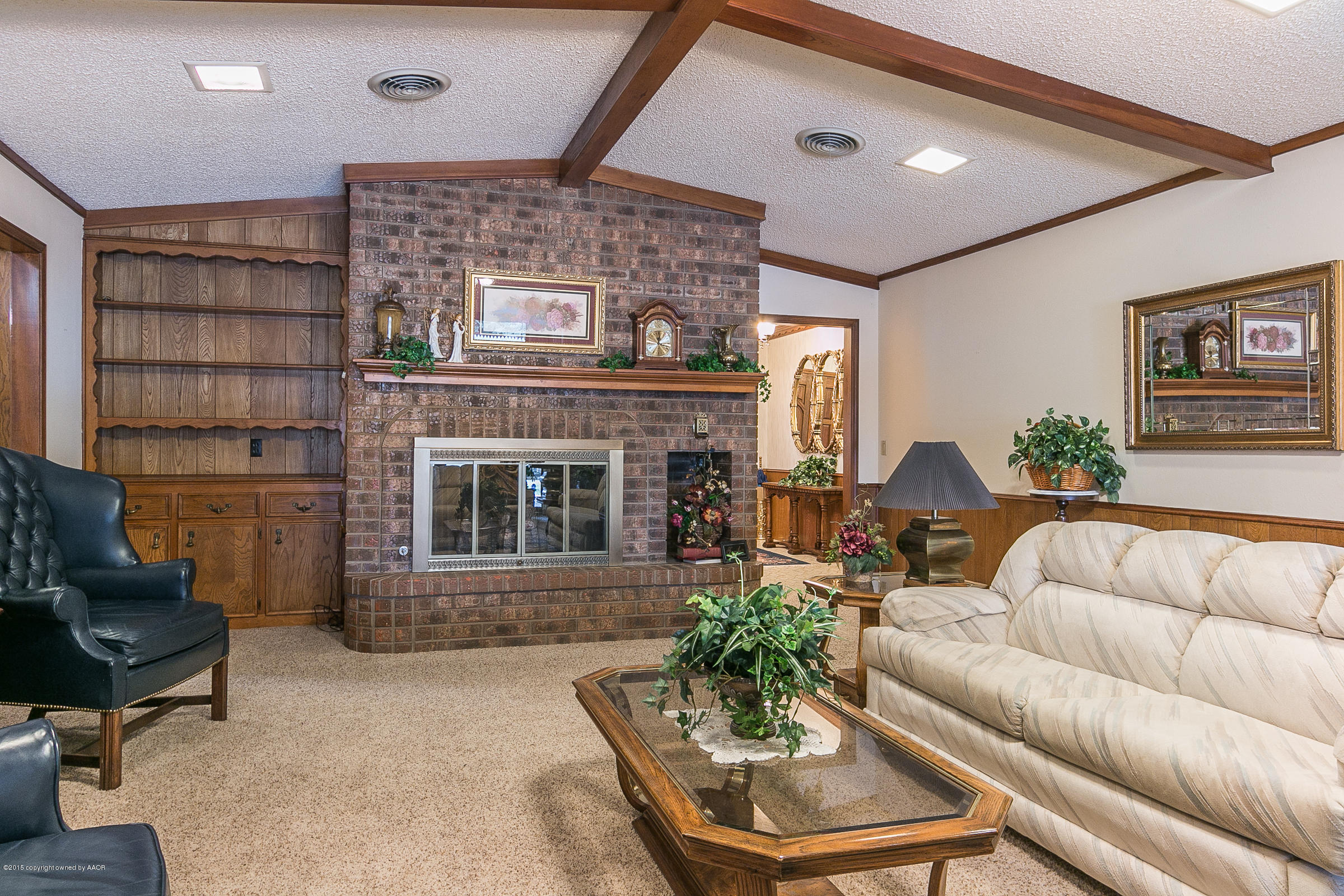 8117 Santa Fe Trail Amarillo, TX 79110 - Photo 6 of 27 a living room with furniture and a fireplace