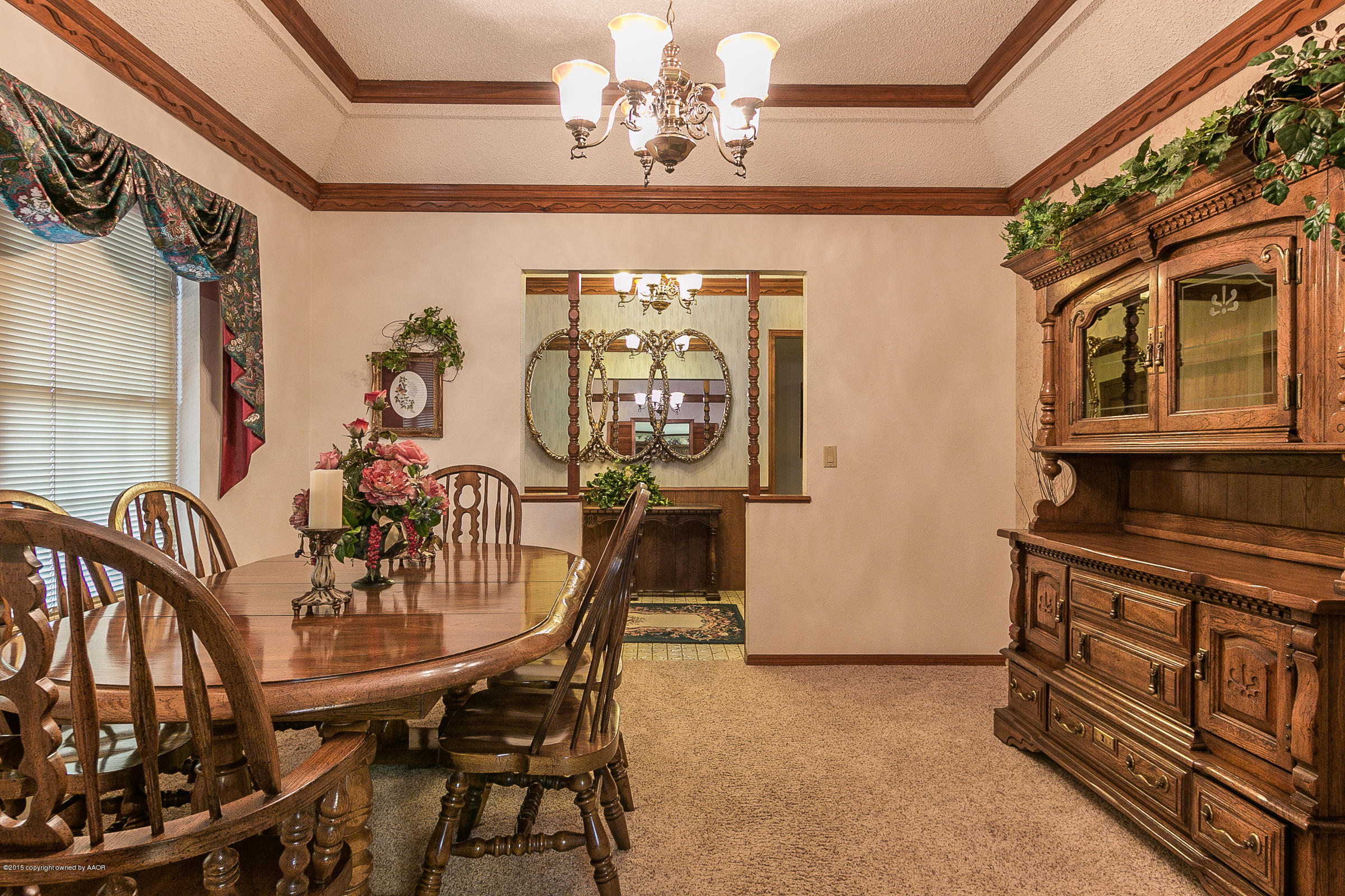 8117 Santa Fe Trail Amarillo, TX 79110 - Photo 8 of 27 a view of a dining room with furniture and chandelier