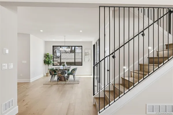 a dining room with furniture ocean view and wooden floor