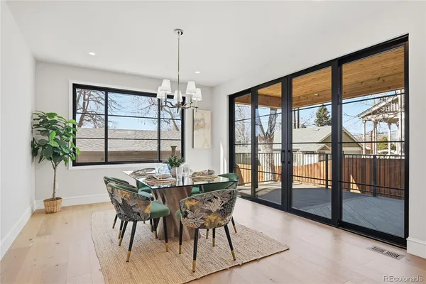 a dining room with furniture window and outdoor view