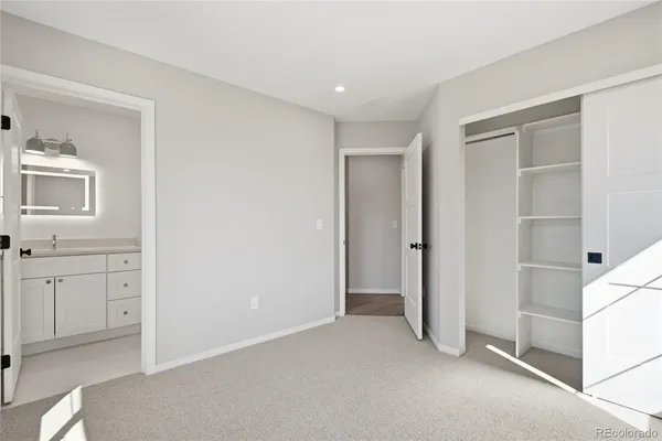 a view of a hallway with closet area