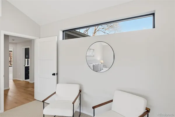 a bathroom with a toilet a sink and a mirror