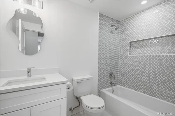 a bathroom with a toilet sink and bathtub