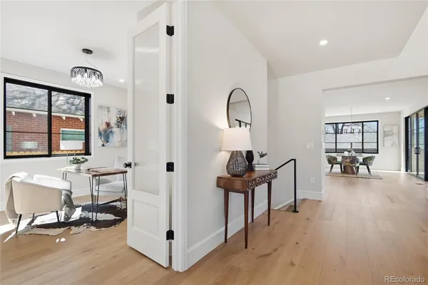 a view of a livingroom with furniture and a table wooden floor