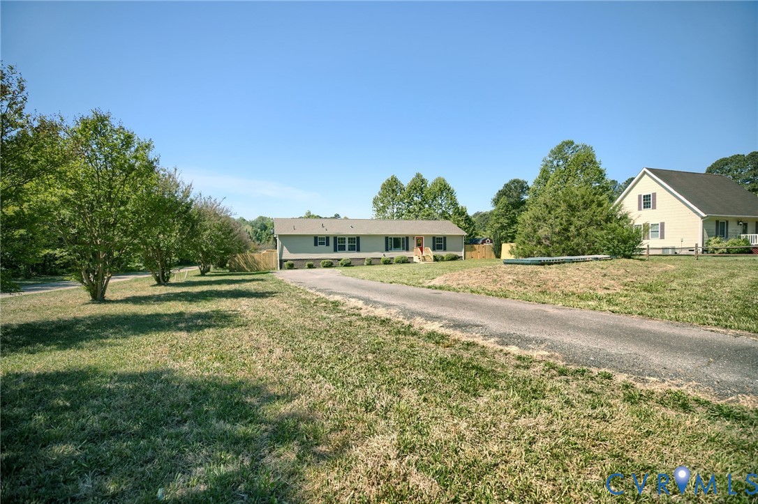 9424 Marlfield Road Gloucester, VA 23061 - Photo 2 of 31 a front view of a house with a yard