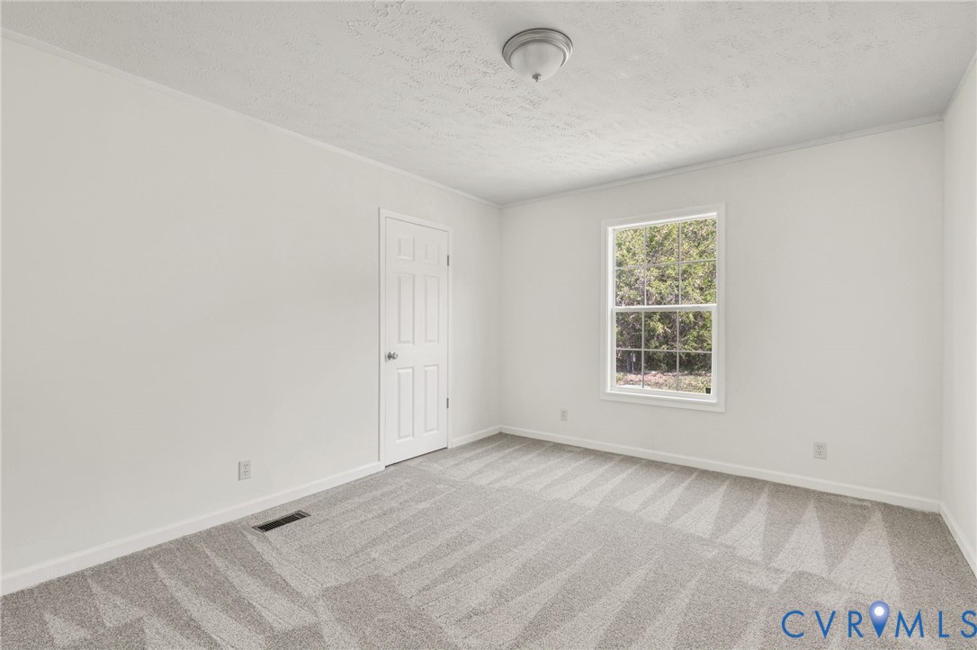9424 Marlfield Road Gloucester, VA 23061 - Photo 22 of 31 an empty room with a window