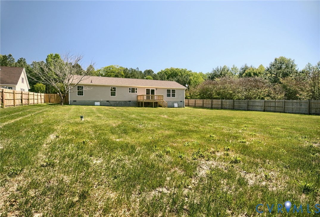 9424 Marlfield Road Gloucester, VA 23061 - Photo 31 of 31 a house with huge green field in front of it