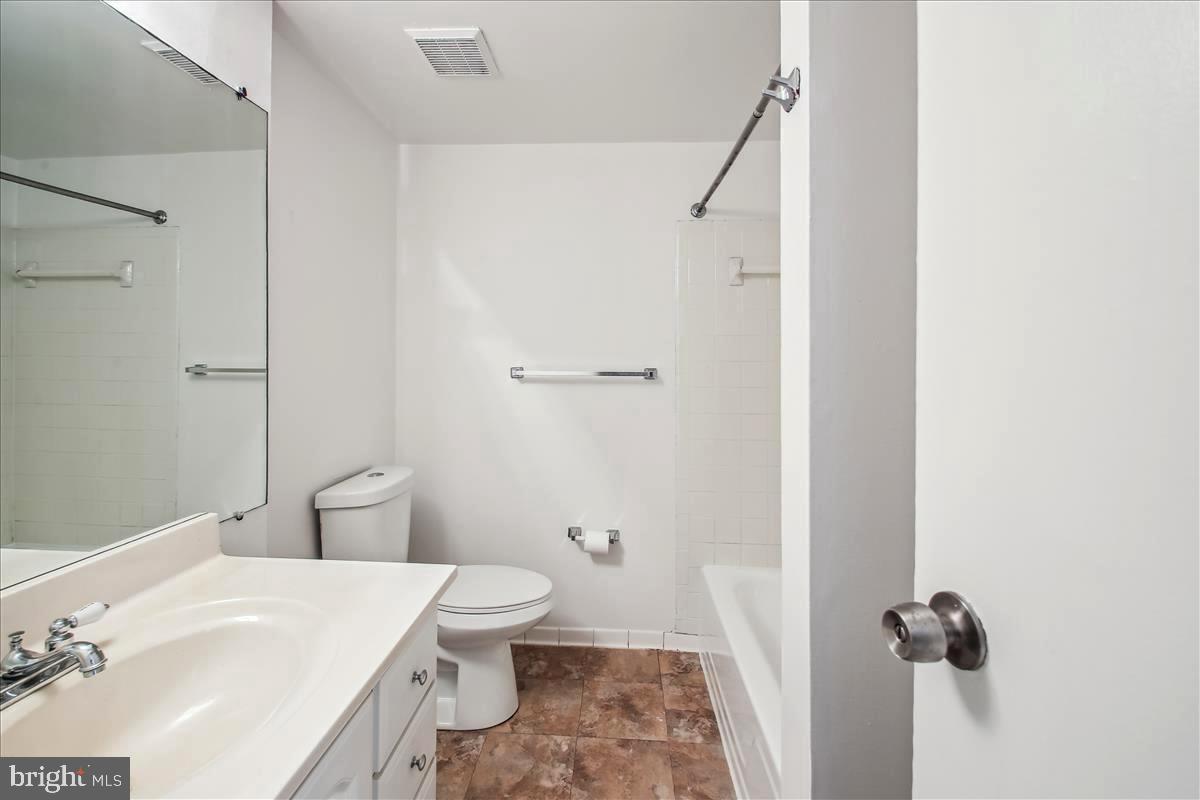 2574 Riva Road, Unit 12A Annapolis, MD 21401 - Photo 20 of 33 a white toilet sitting next to a bathroom sink