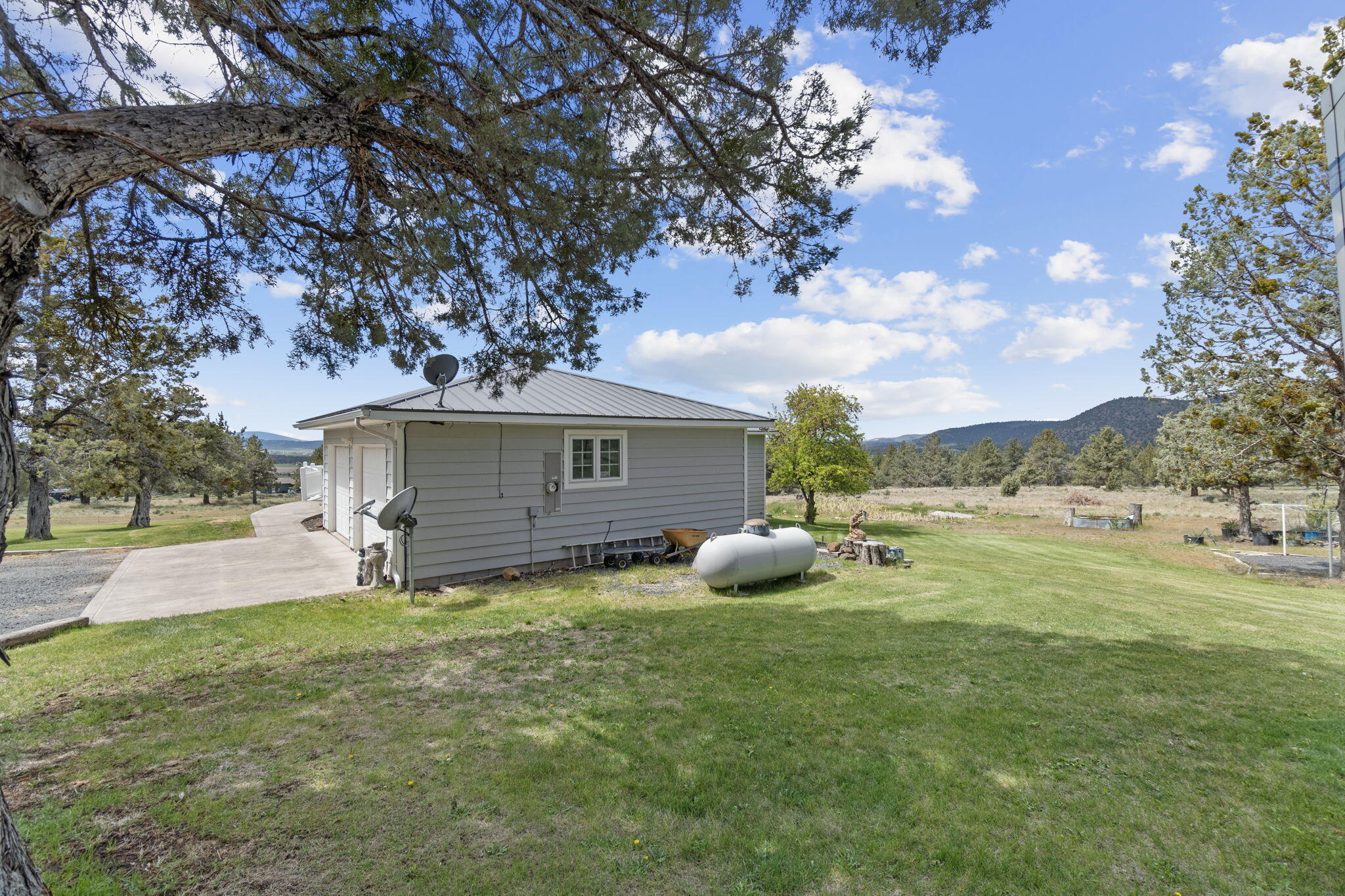 17722 Pope Road Merrill, OR 97633 - Photo 57 of 61 a view of a backyard with large trees