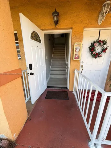 a view of a entryway door of a house