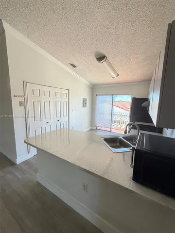 a view of a livingroom with furniture and staircase