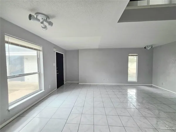 a view of an empty room and window