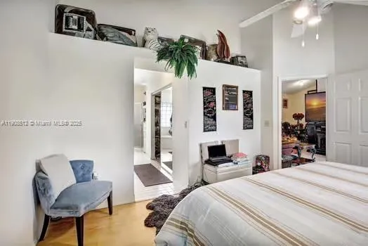 a bedroom with furniture and a potted plant