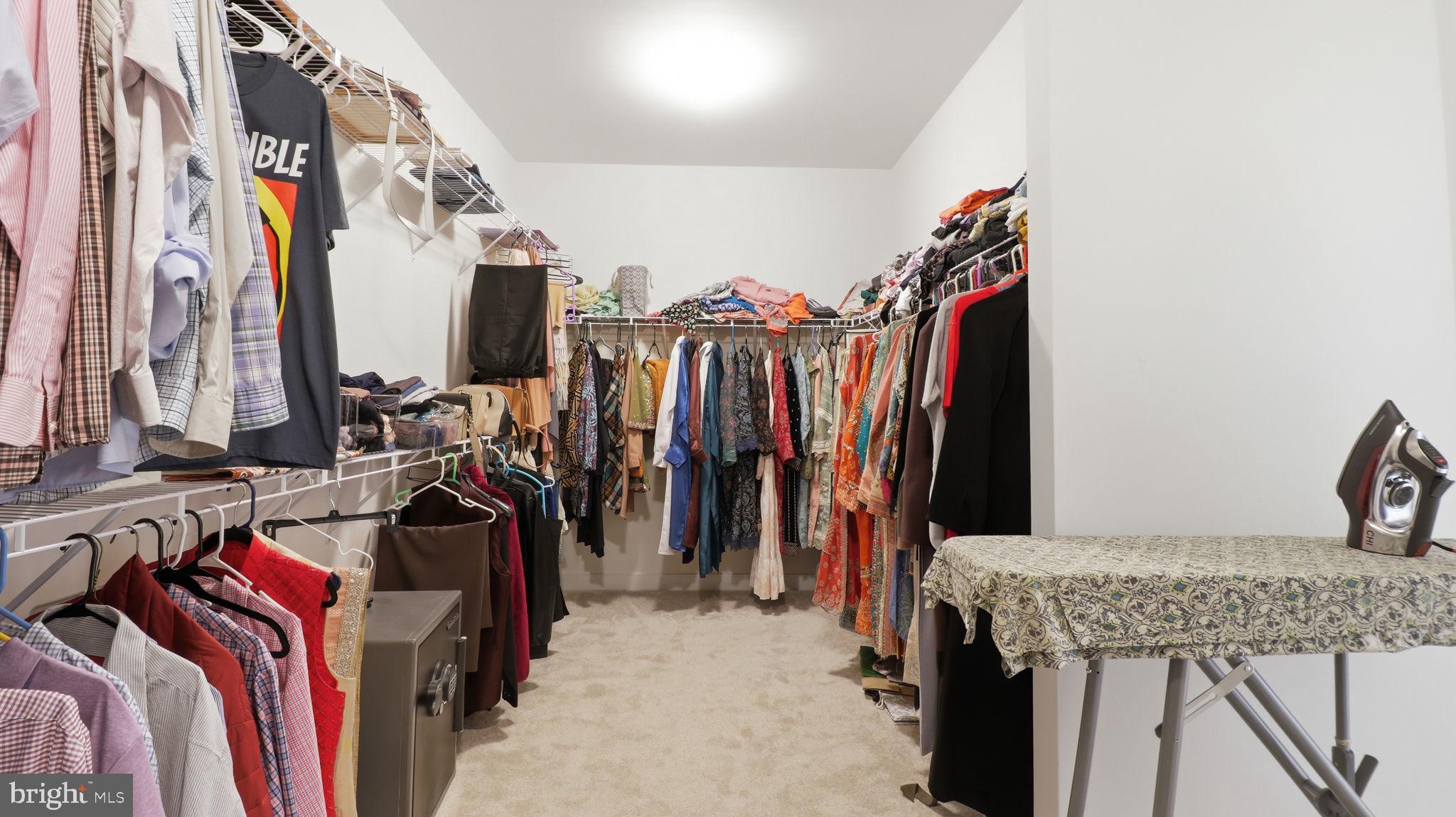 11502 Aden Road Nokesville, VA 20181 - Photo 75 of 106 a view of walk in closet with clothes