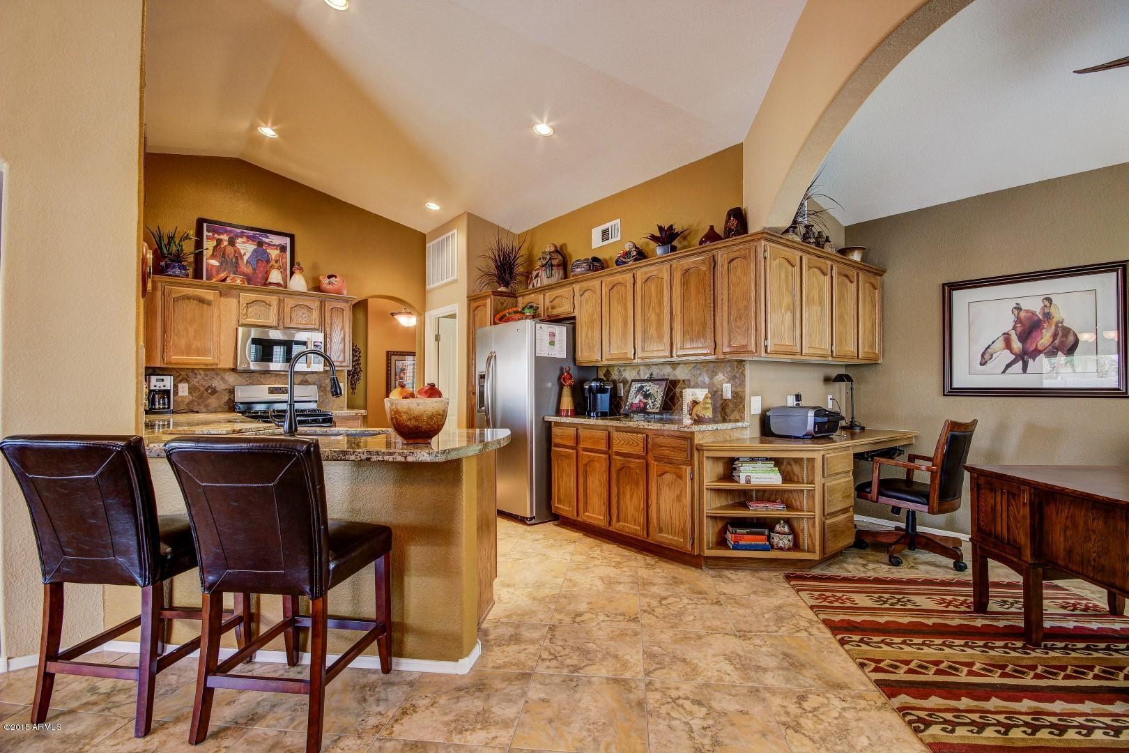 15504 Piccadilly Road Goodyear, AZ 85395 - Photo 19 of 49 Breakfast Bar_Built-In Desk in Kitchen