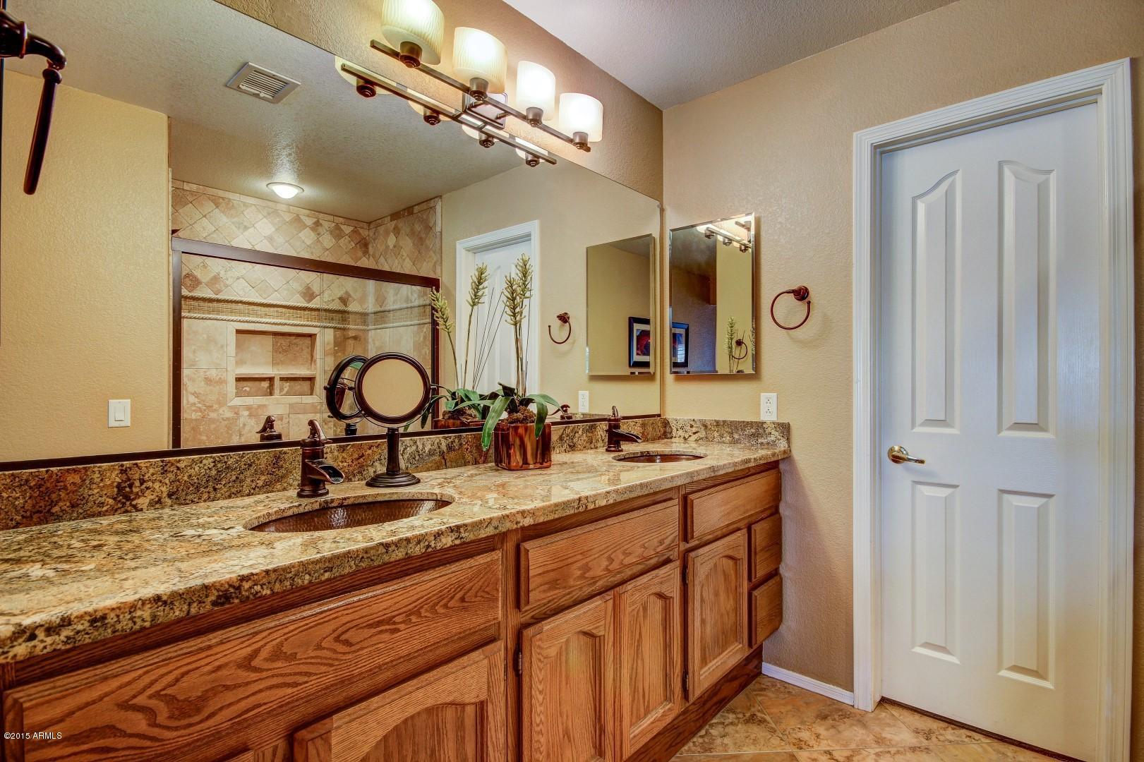 15504 Piccadilly Road Goodyear, AZ 85395 - Photo 29 of 49 Granite_Copper Sinks_Oil Rubbed Hardware