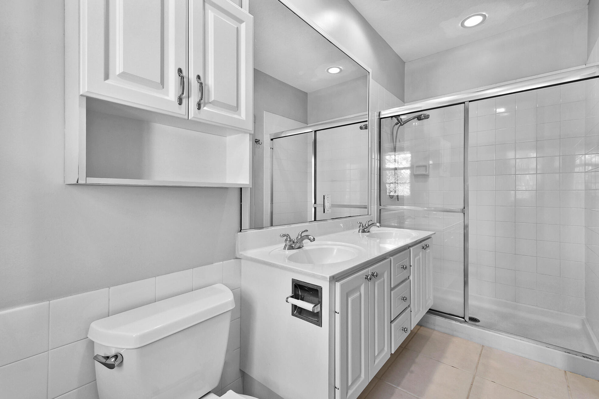 1836 Jeaga Drive Jupiter, FL 33458 - Photo 14 of 25 a bathroom with a sink a toilet and shower