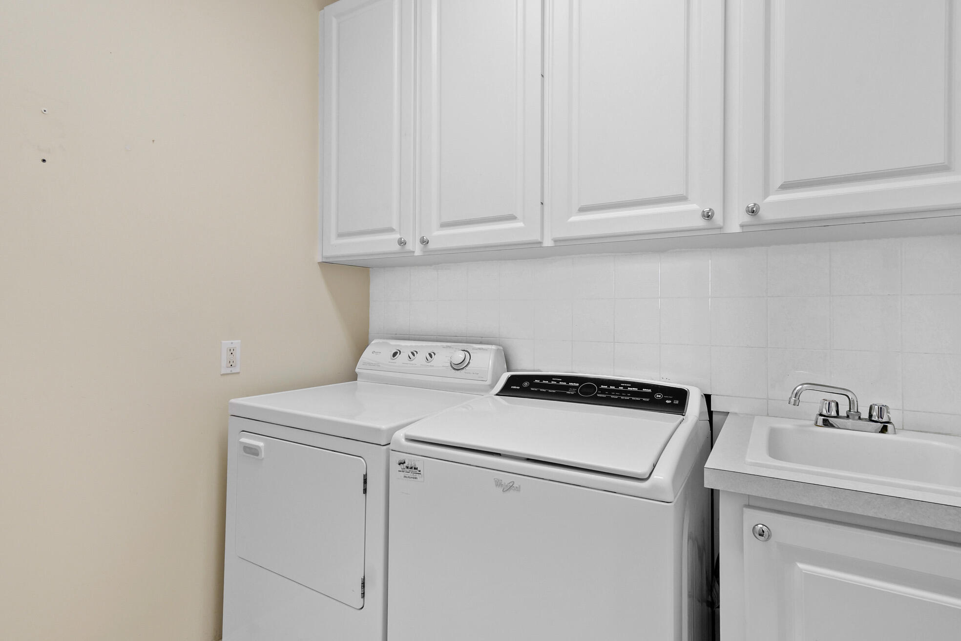 1836 Jeaga Drive Jupiter, FL 33458 - Photo 20 of 25 a utility room with dryer and washer