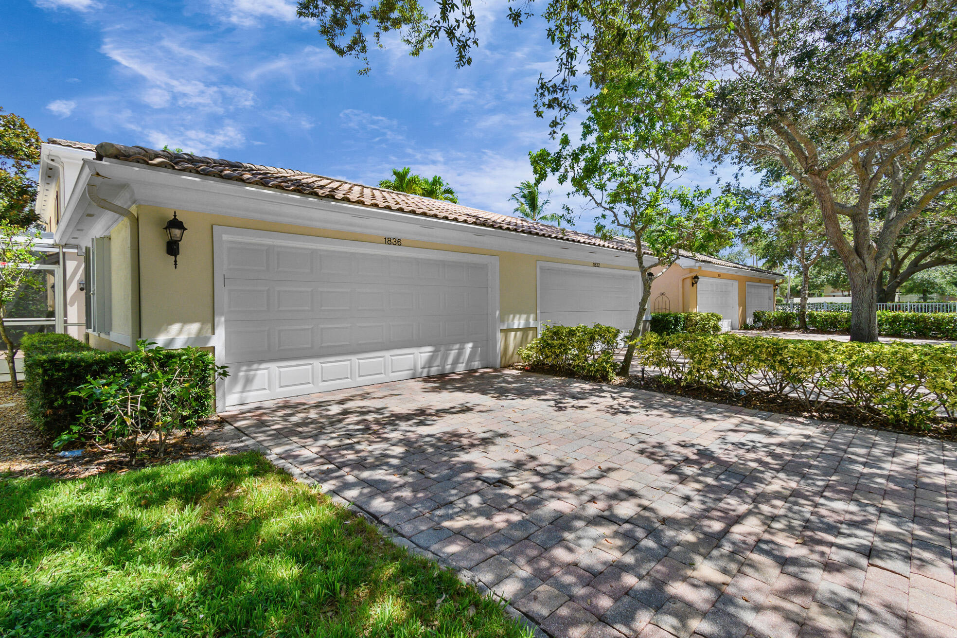 1836 Jeaga Drive Jupiter, FL 33458 - Photo 22 of 25 a pathway of a house with a yard