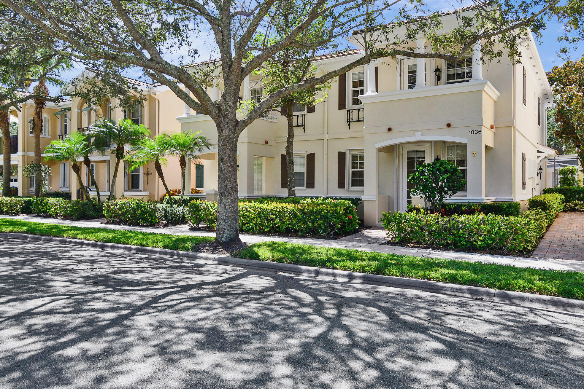 1836 Jeaga Drive Jupiter, FL 33458 - Photo 23 of 25 a front view of a house with a garden