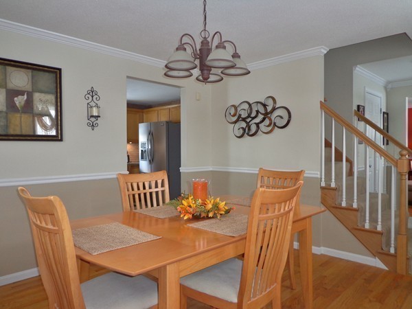 22 Pheasant Drive Springfield, MA 01119 - Photo 14 of 28 a view of a dining room with furniture wooden floor and a chandelier