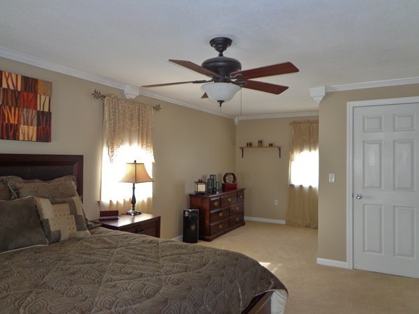 22 Pheasant Drive Springfield, MA 01119 - Photo 18 of 28 a bedroom with a bed and a chandelier