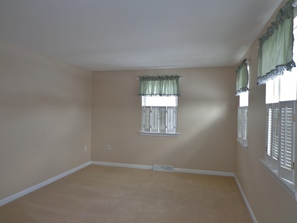 22 Pheasant Drive Springfield, MA 01119 - Photo 20 of 28 an empty room with windows