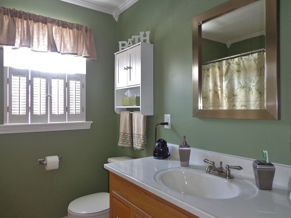 22 Pheasant Drive Springfield, MA 01119 - Photo 24 of 28 a bathroom with a toilet sink and mirror