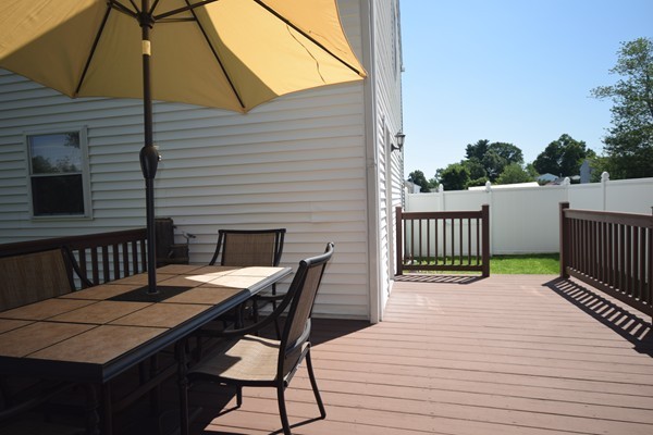 22 Pheasant Drive Springfield, MA 01119 - Photo 26 of 28 a view of a roof deck with wooden floor and fence