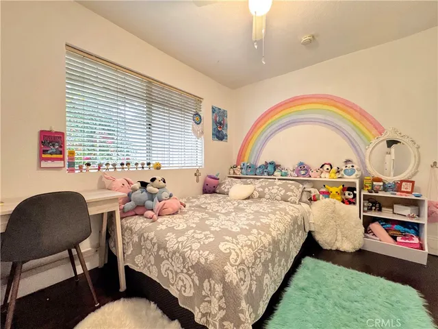 a bed room with a bed and a chair