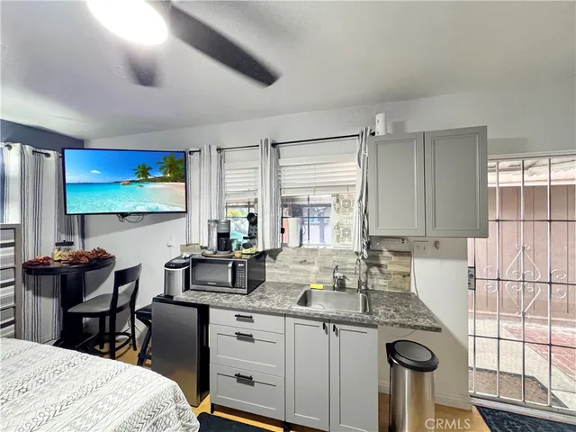 a kitchen with sink cabinets and window