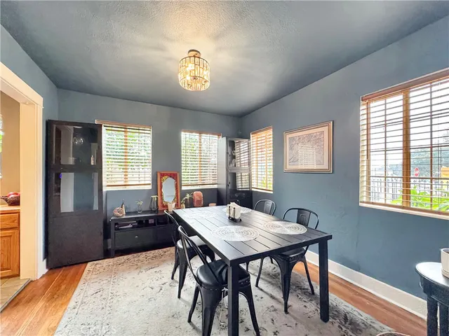 a view of a dining room with furniture and window