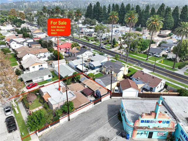 a view of a house with yard and a garden