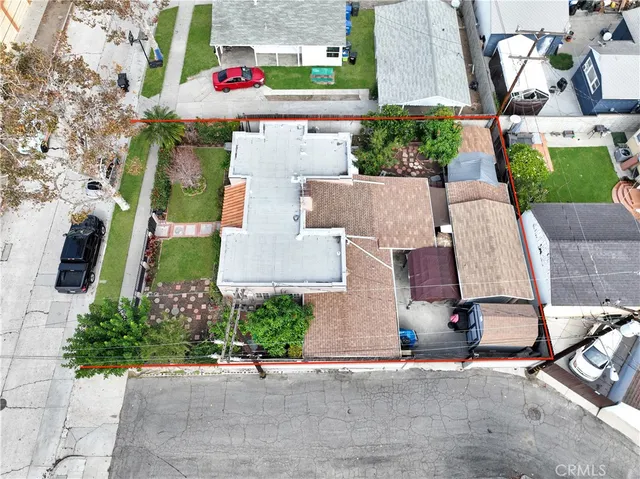 an aerial view of residential houses with outdoor space