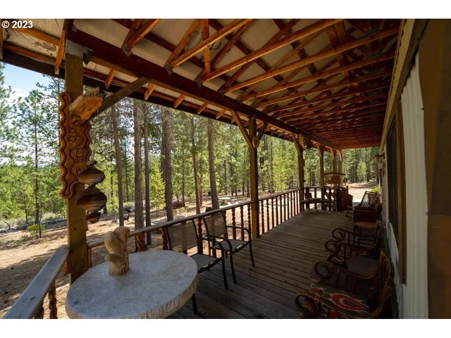 a view of living room with furniture and floor to ceiling window