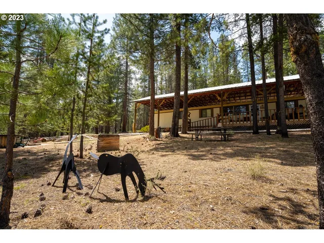a view of a swimming pool with furniture