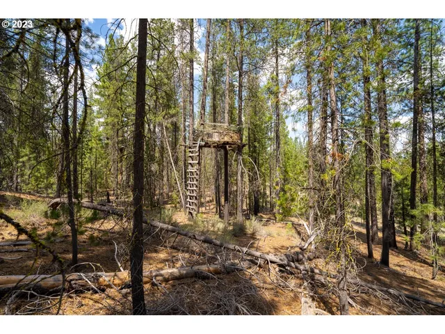 a view of house with outdoor seating
