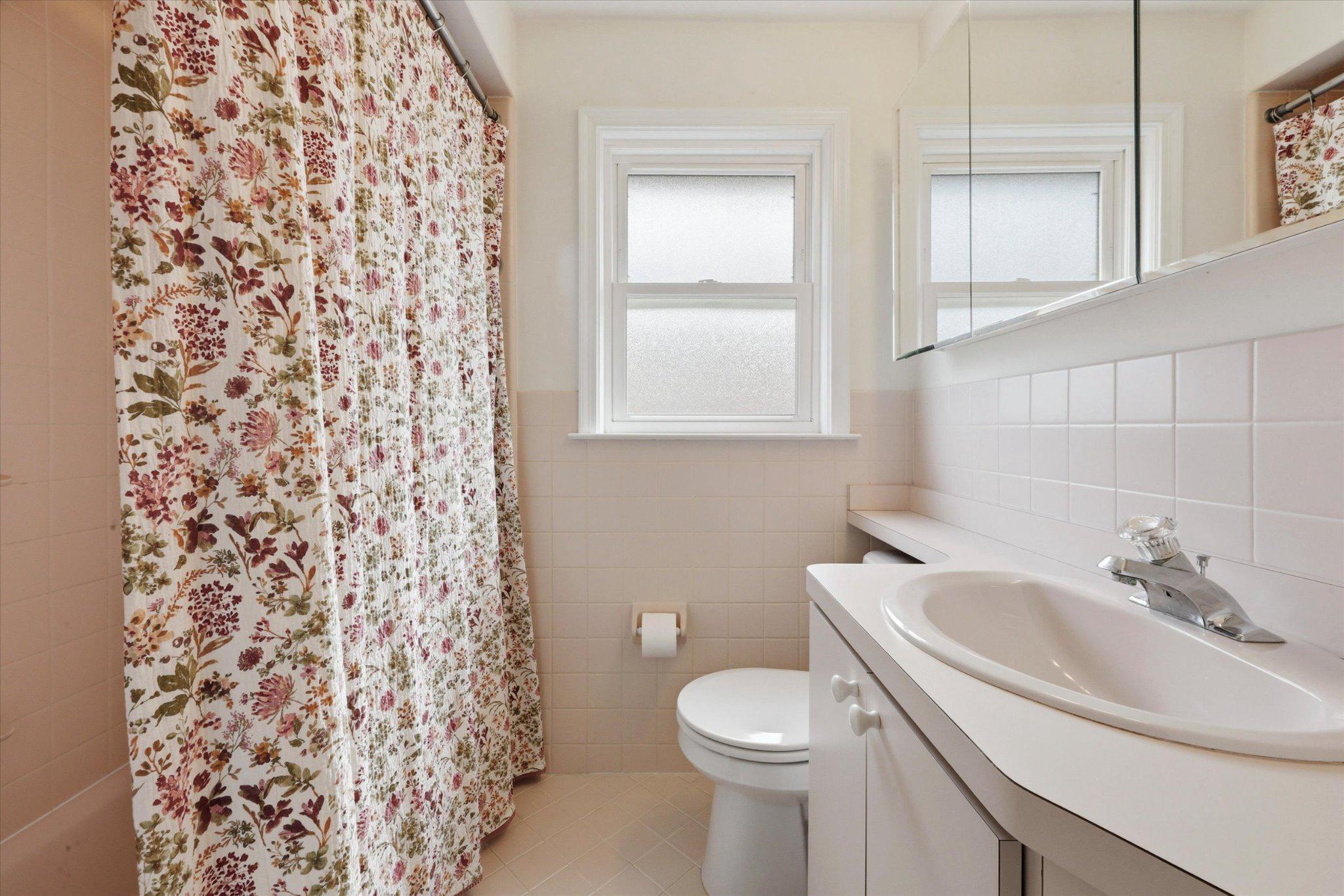 615 Michell Street Ridley Park, PA 19078 - Photo 18 of 25 a white toilet sitting next to a bathroom sink