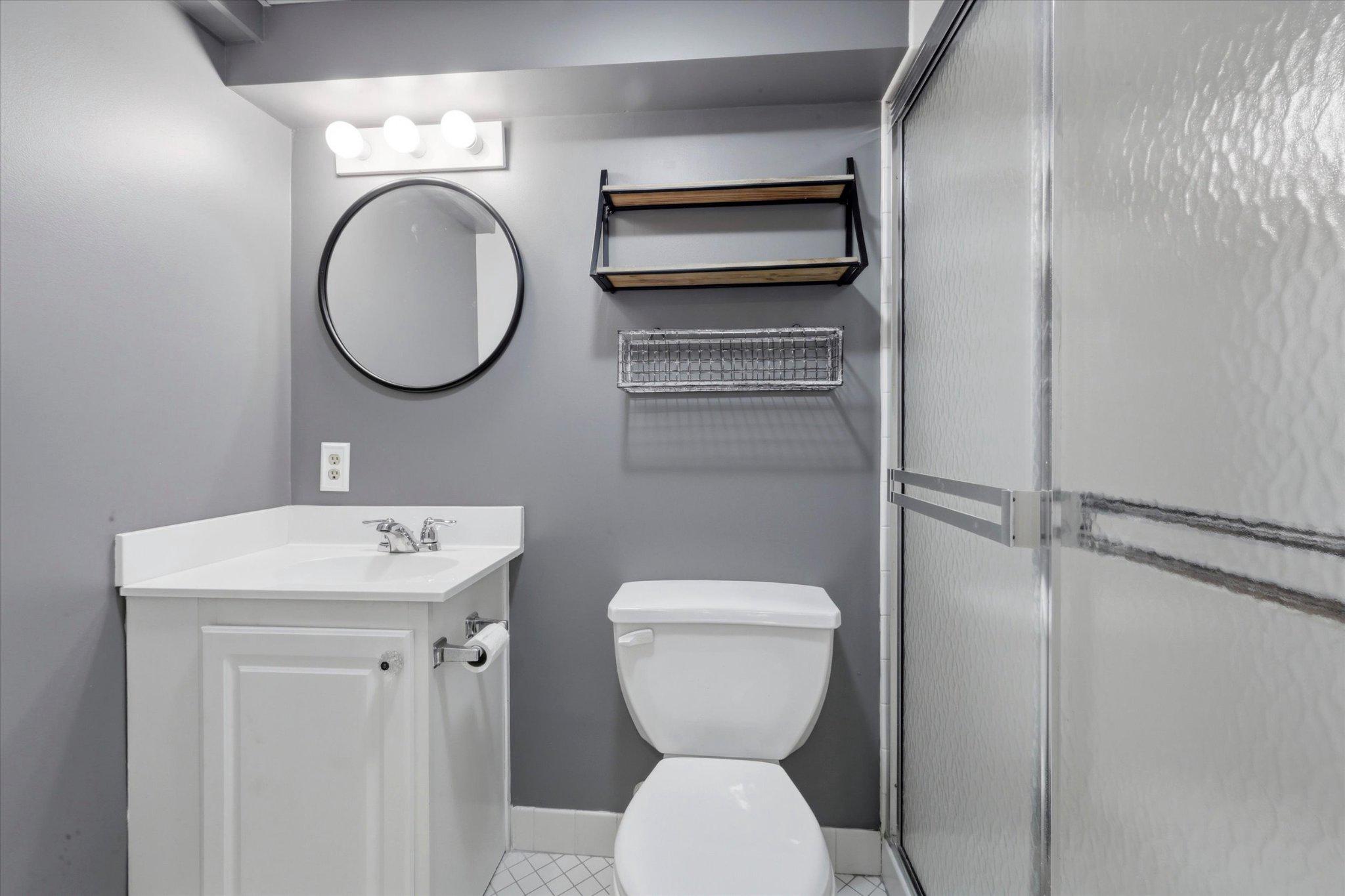615 Michell Street Ridley Park, PA 19078 - Photo 20 of 25 a bathroom with a toilet a sink and a mirror