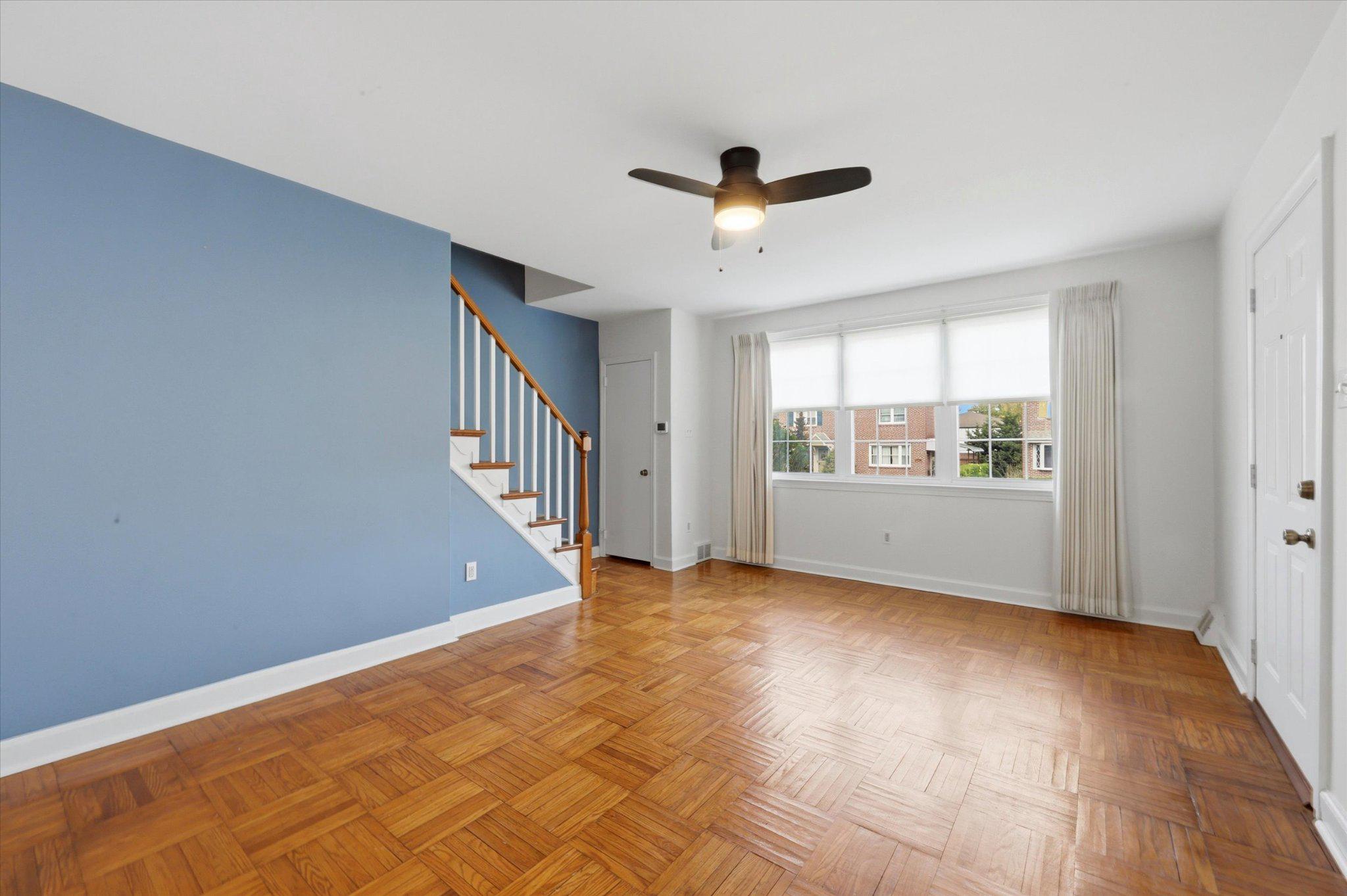 615 Michell Street Ridley Park, PA 19078 - Photo 4 of 25 a view of an empty room with window chandelier fan and fire place