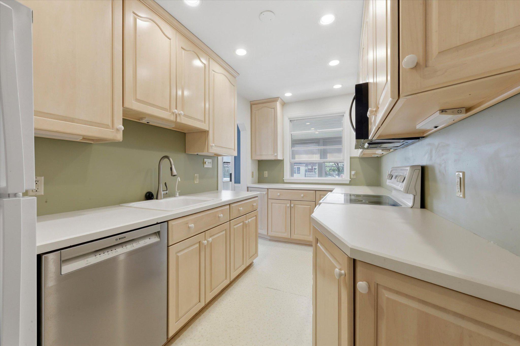 615 Michell Street Ridley Park, PA 19078 - Photo 7 of 25 a kitchen with stainless steel appliances granite countertop a sink a stove and a refrigerator
