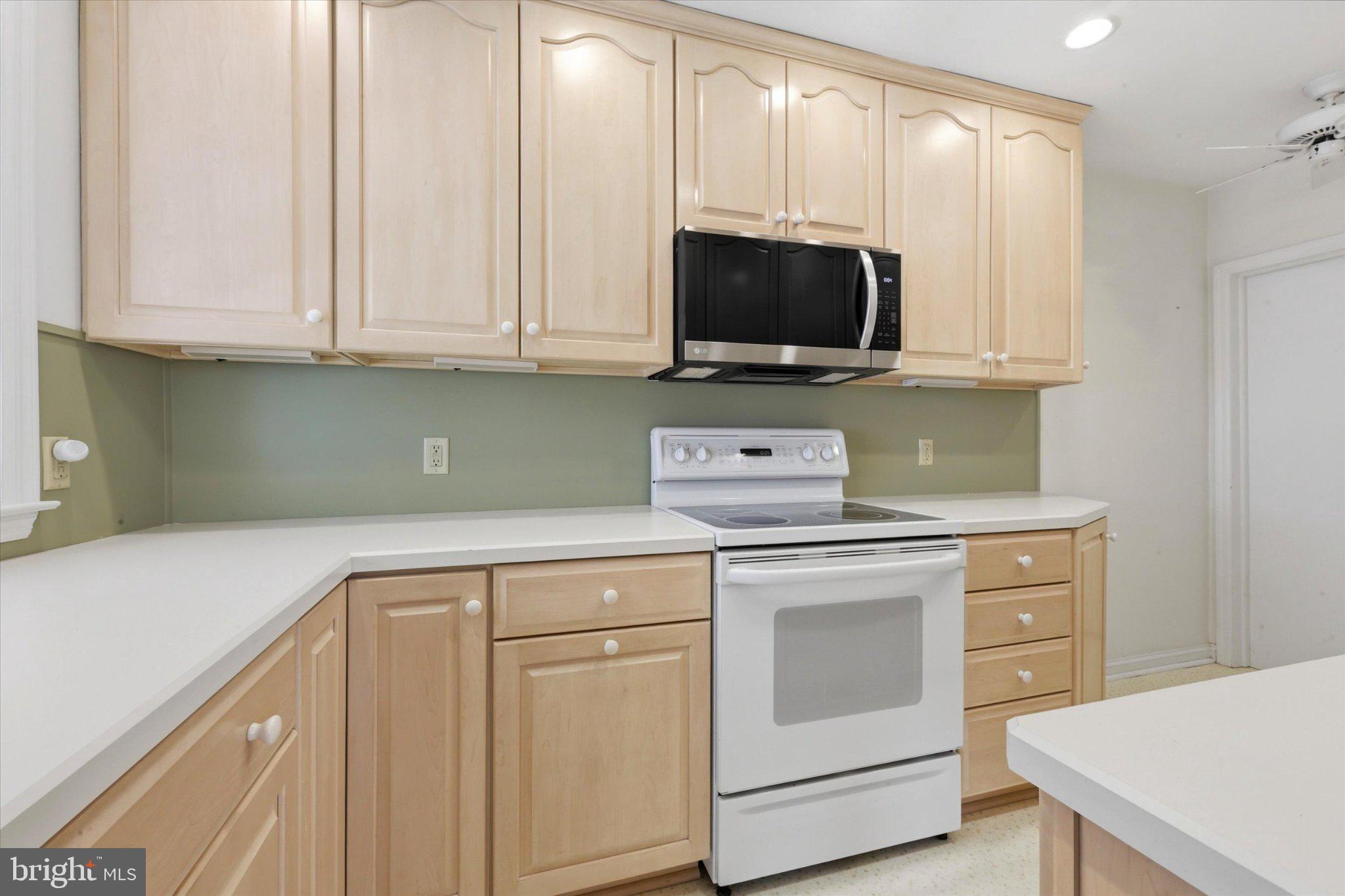 615 Michell Street Ridley Park, PA 19078 - Photo 8 of 25 a kitchen with white cabinets and stainless steel appliances