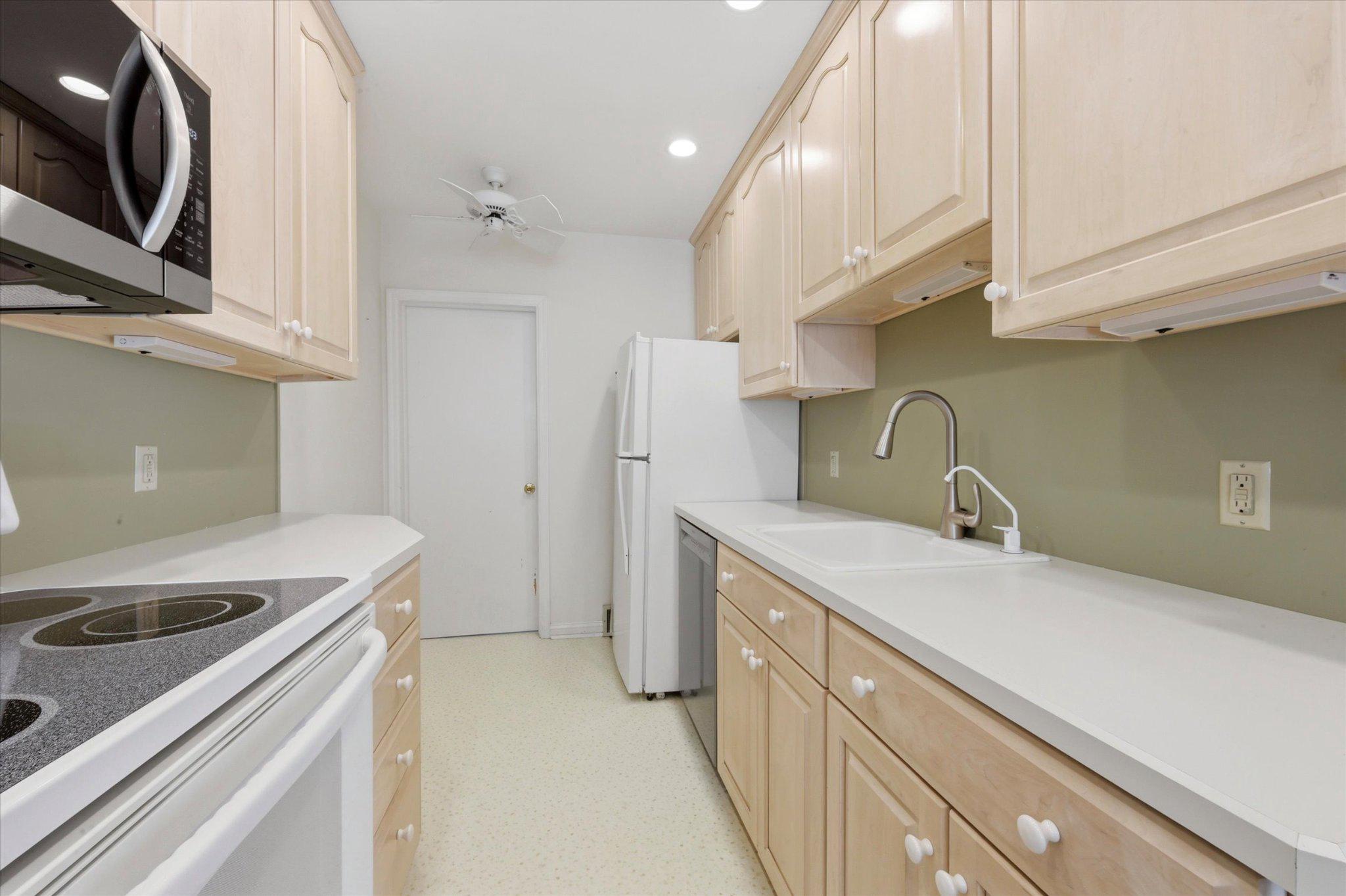 615 Michell Street Ridley Park, PA 19078 - Photo 9 of 25 a kitchen with a sink and a refrigerator