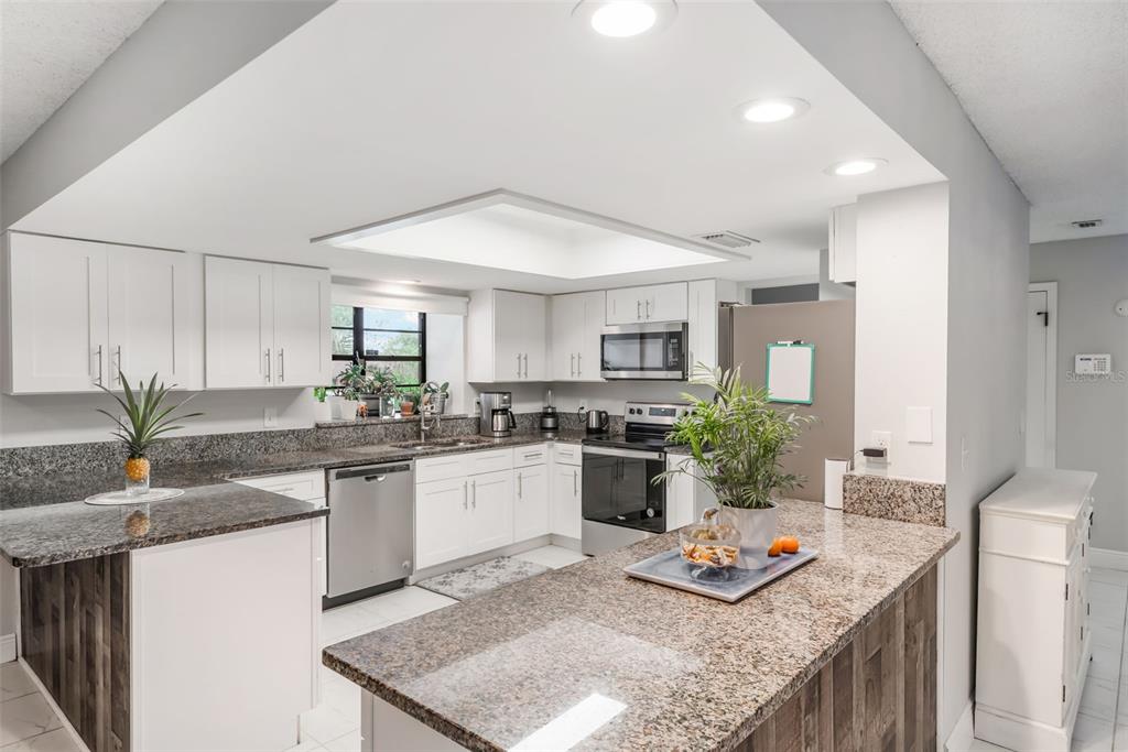 1760 12th Street Clermont, FL 34711 - Photo 11 of 42 a kitchen with granite countertop lots of counter top space