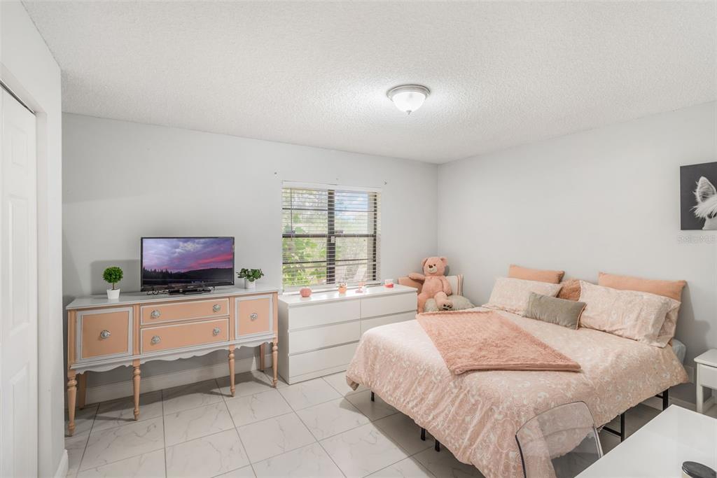 1760 12th Street Clermont, FL 34711 - Photo 20 of 42 a bedroom with a bed and window