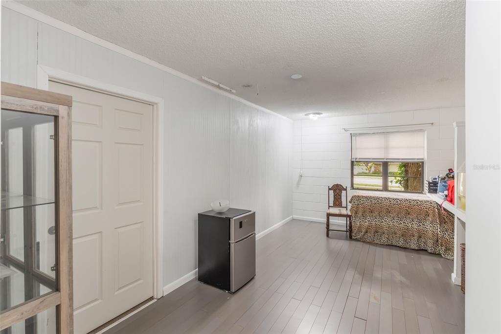1760 12th Street Clermont, FL 34711 - Photo 27 of 42 a living room with furniture and a wooden floor