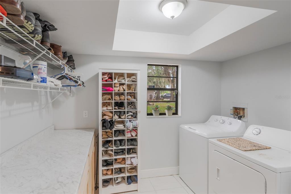 1760 12th Street Clermont, FL 34711 - Photo 29 of 42 a view of walk in closet with empty racks