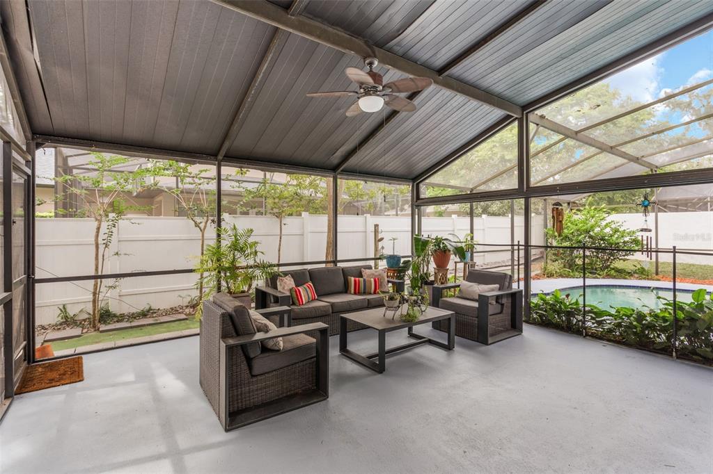 1760 12th Street Clermont, FL 34711 - Photo 30 of 42 a living room with furniture and a floor to ceiling window
