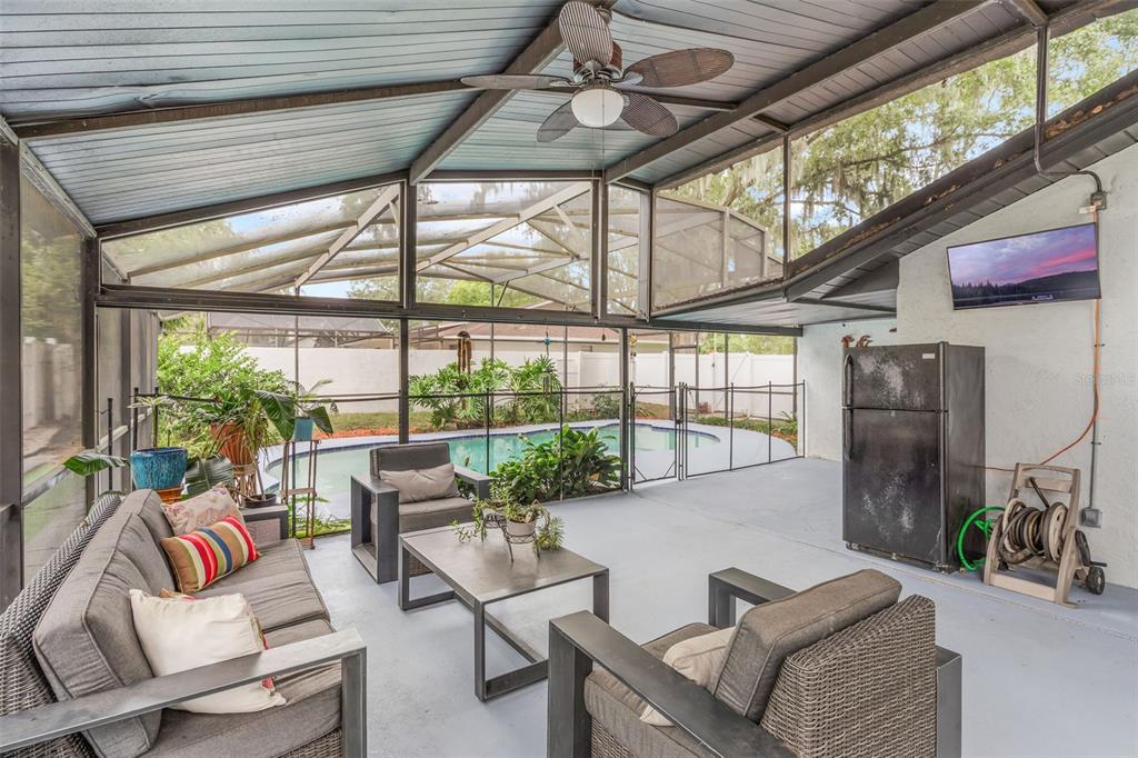 1760 12th Street Clermont, FL 34711 - Photo 31 of 42 a living room with patio furniture and a potted plant