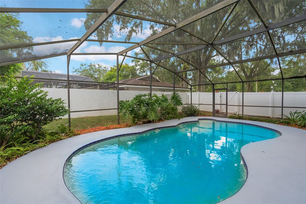 1760 12th Street Clermont, FL 34711 - Photo 35 of 42 a view of a swimming pool with a porch